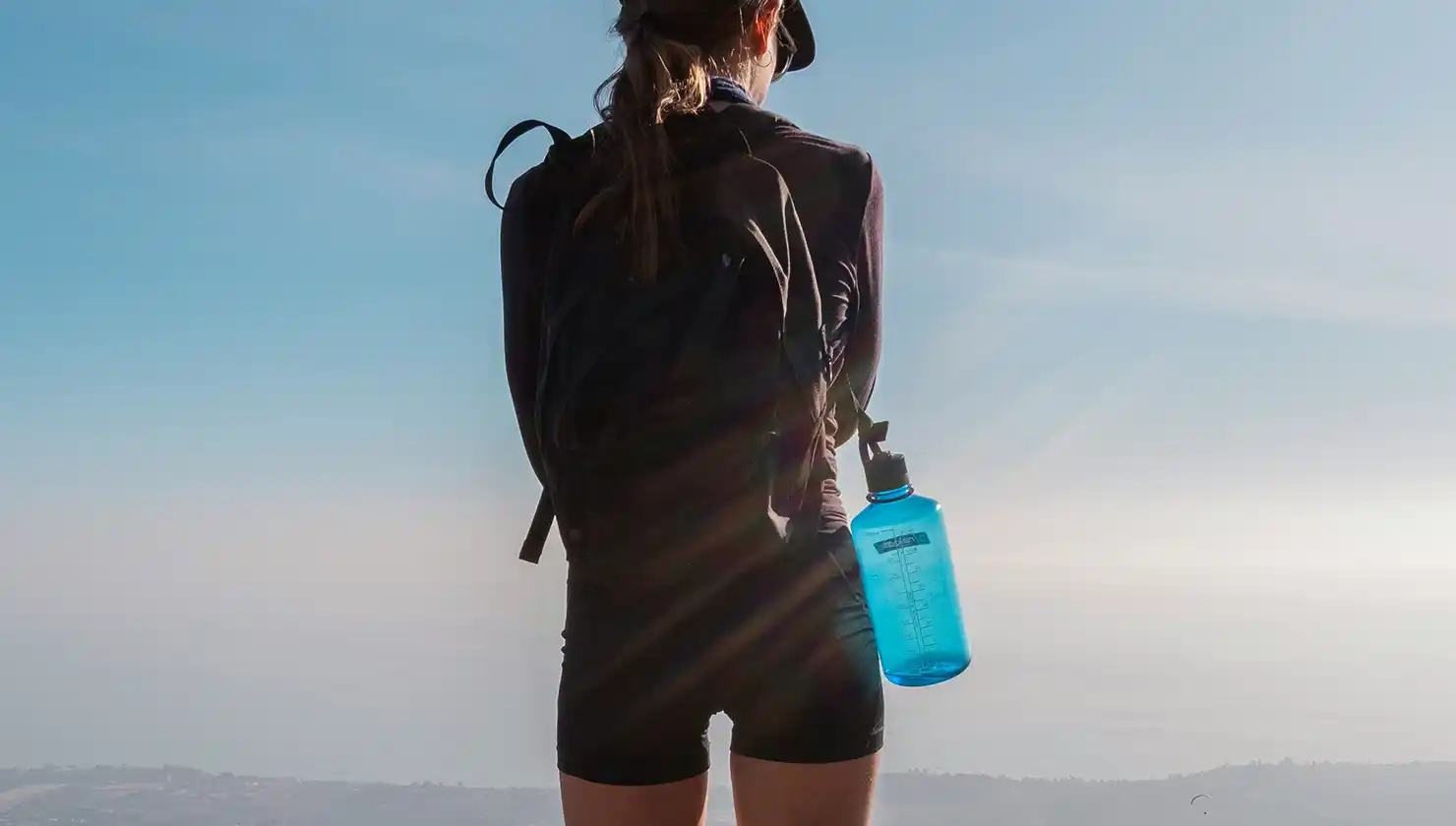 Active woman hiking in Colorado - possible candidate for a tummy tuck